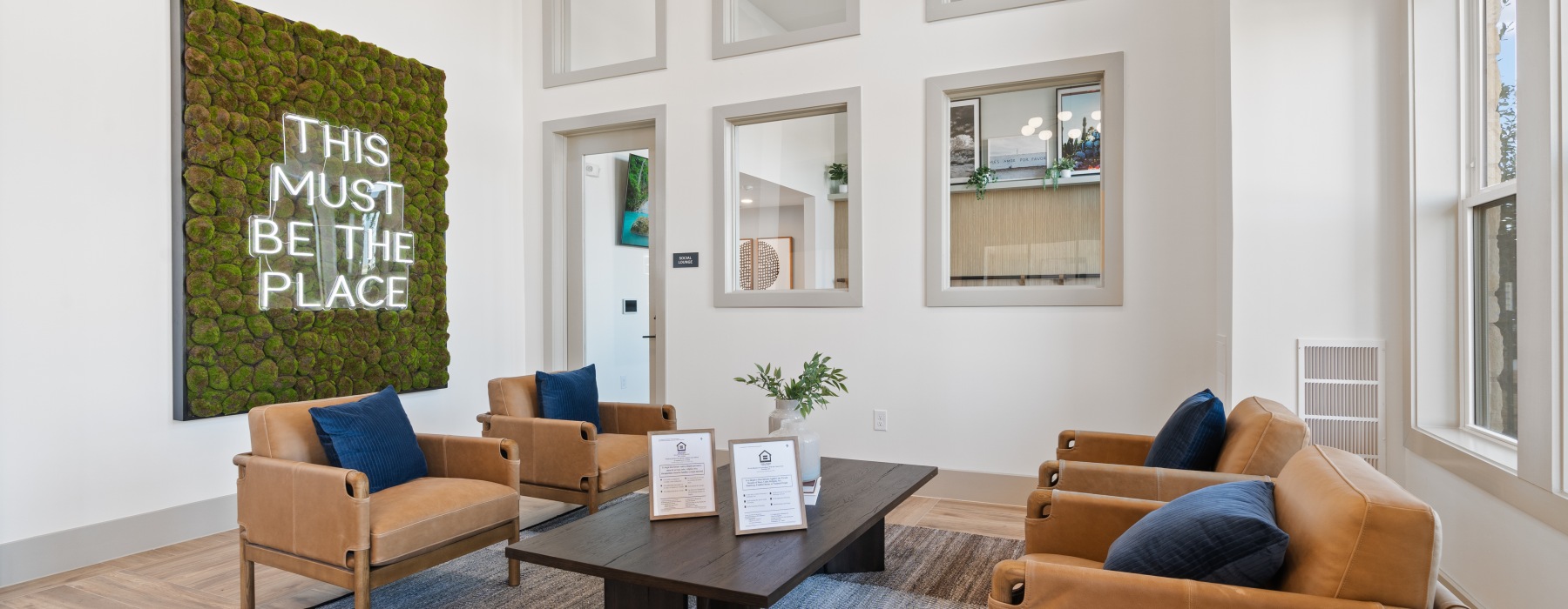 Leasing offie seating with 4 leather chairs and large art piece