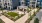 Aerial view of the courtyard area with covered grills and cornhole games